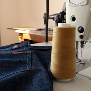 Industrial sewing machine hemming jeans